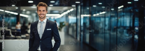 A handsome smiling man in a suit stands in front of the office. Created with Generative AI technology.