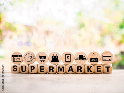 Wooden block with word SUPERMARKET and online shopping, e-commerce icons set. photo