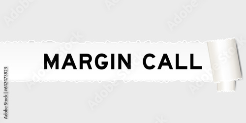 Ripped gray paper background that have word margin call under torn part