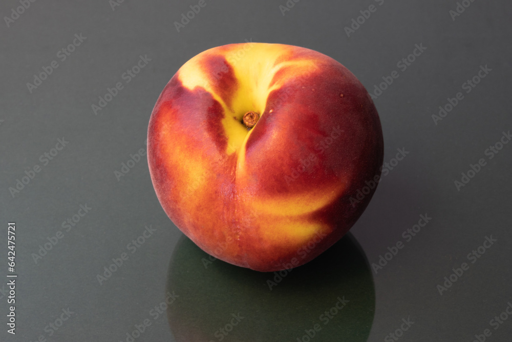 Peach on a dark green background Peach on a dark green background