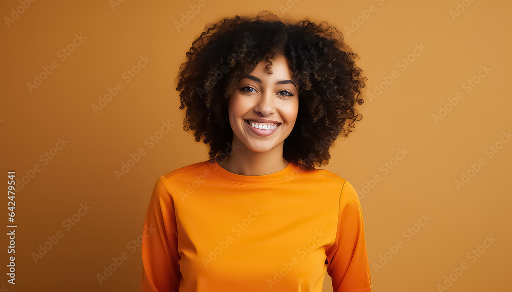 portrait of beautiful african woman standing against orange background
