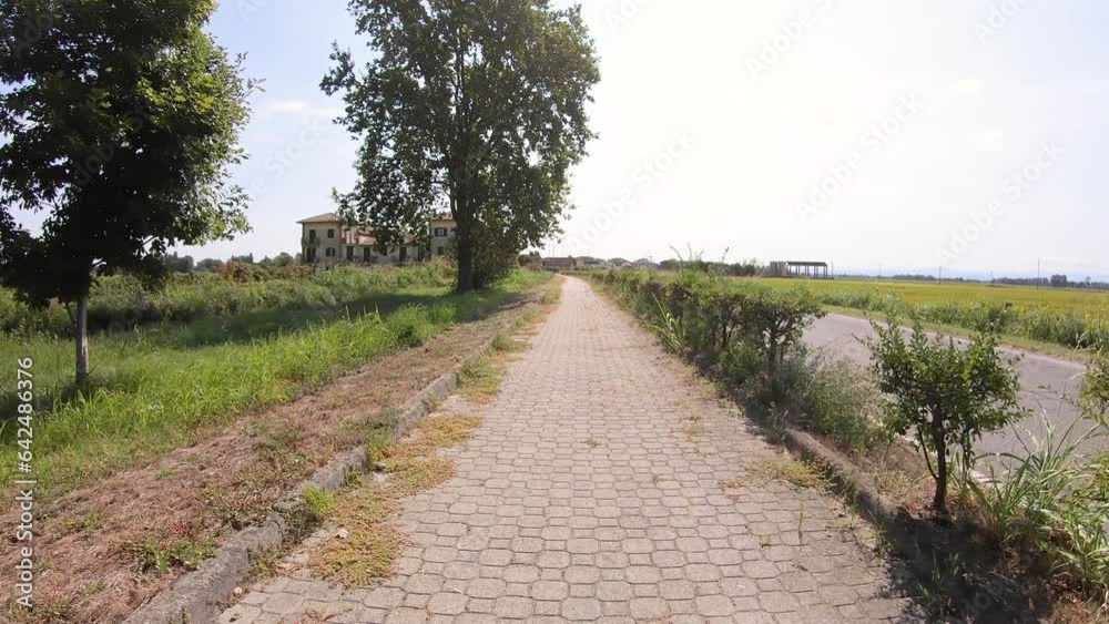 Street road paved with tiles entering Zerbolò, Province of Pavia, Lombardy, Italy Street road paved with tiles entering Zerbolò, Province of Pavia, Lombardy, Italy
