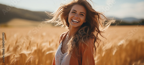portrait of a woman in a wheat field enjoying sunny day