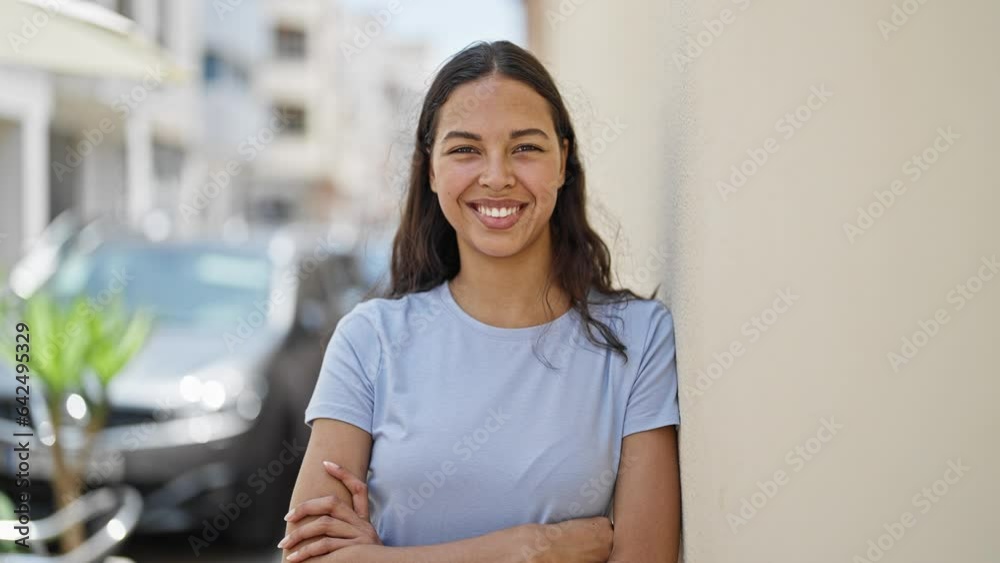 African american woman smiling confident standing with arms crossed gesture at street African american woman smiling confident standing with arms crossed gesture at street