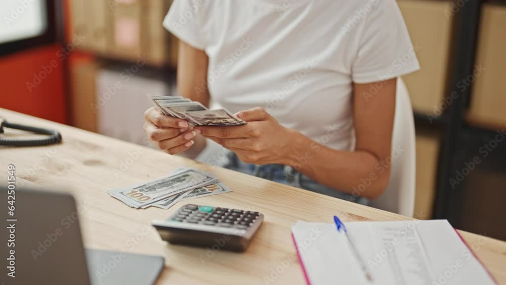 African american woman ecommerce business worker counting dollars smiling at office African american woman ecommerce business worker counting dollars smiling at office