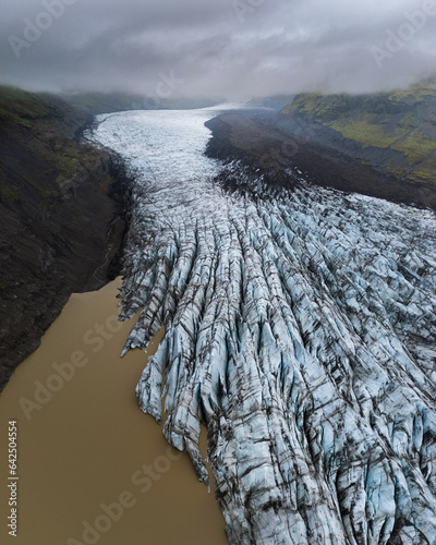 Arial drone view of Svinafell glacier in Iceland, part of Vatnajokull during cloudy day © Zbigniew Wu