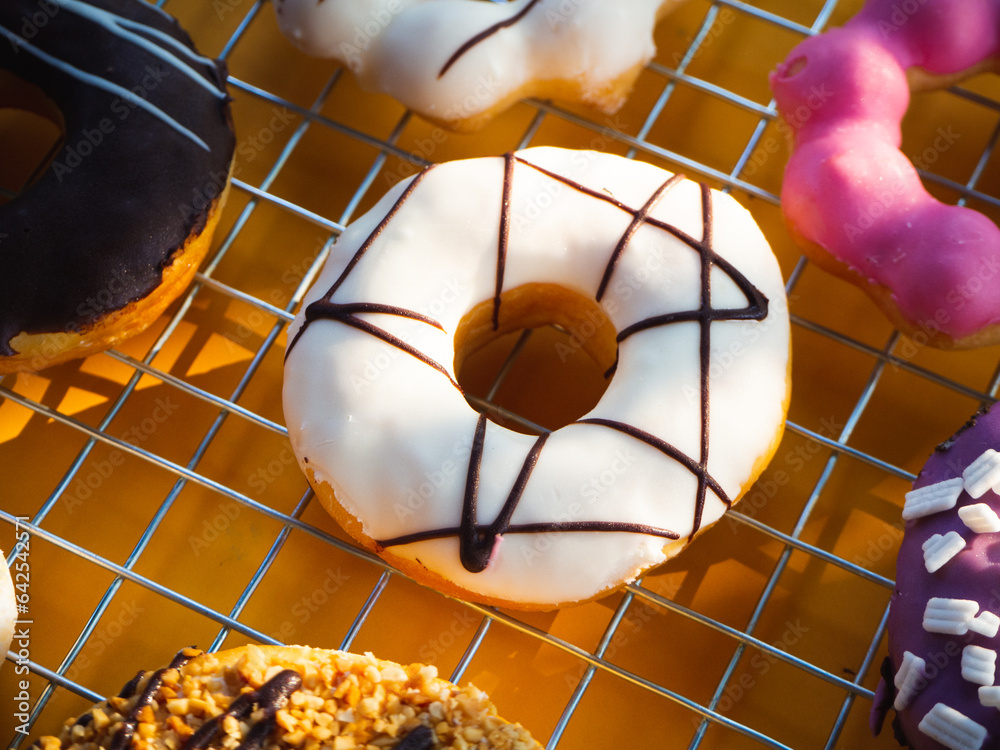Donuts with icing on cooking wire rack. Top view Donuts with icing on cooking wire rack. Top view