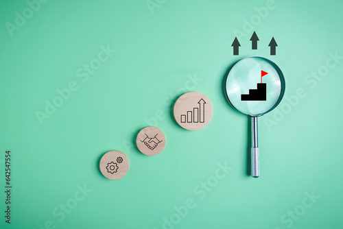 Magnifying glass with business target goal icons, Business growth process, Business strategy planning management, Business workflow development, Quality control assessment, Economic improvement