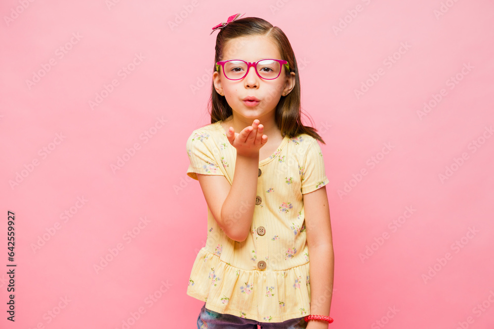 Cute caucasian kid looking loving blowing kisses Cute caucasian kid looking loving blowing kisses