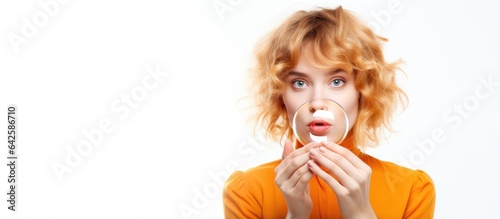 Young girl holding an orang...