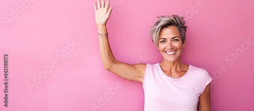 Smiling woman happily wavin...