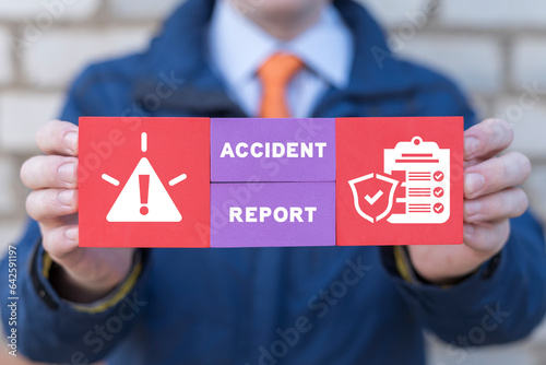 Businessman holding colorful styrofoam blocks and sees inscription: ACCIDENT REPORT. Concept of accident report. Claim injury compensation. Filling of accident report form.