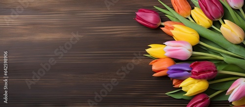 Colorful tulips on wooden t...