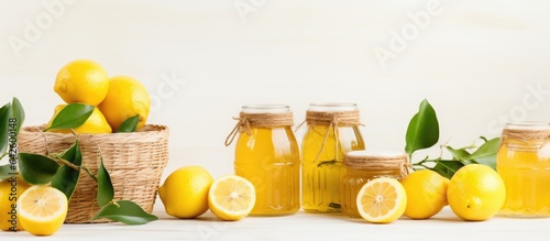 Fresh lemon abstract mix in baskets and bowls with marmalade jar promoting healthy eating with white space for text photo
