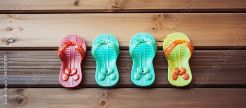 Infant sandals on wood back...