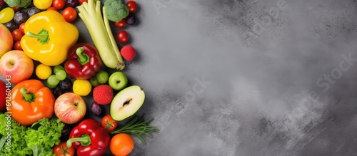 Top view of fresh fruits and vegetables on concrete background