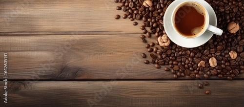 Various items on wooden surface above hot coffee from above
