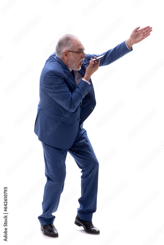 Old businessman talking by phone isolated on white Old businessman talking by phone isolated on white