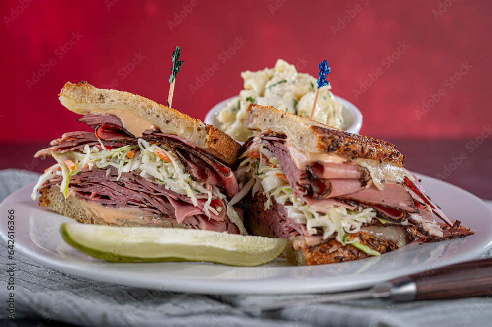 Pastrami on Rye and Coleslaw with Potato Salad and a Pickle. Stock
