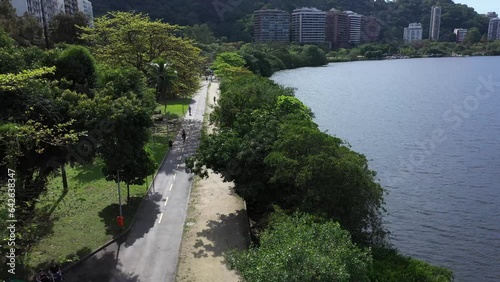 Aerial view of the leisure area and running track at Lagoa Rodrigo de Freitas, where people are jogging and exercising on a beautiful winter's morning in Rio de Janeiro.