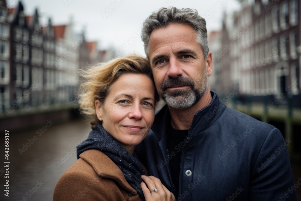 A couple in their 40s at the Anne Frank House in Amsterdam Netherlands A couple in their 40s at the Anne Frank House in Amsterdam Netherlands