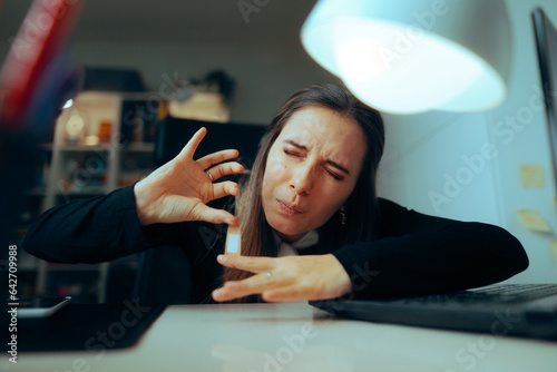 Tableau sur toile Woman Hurting her Finger at the Office Using Adhesive Bandage