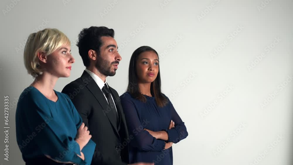 Group of multi national people looking screen in dark room. Group of multi national people looking screen in dark room.