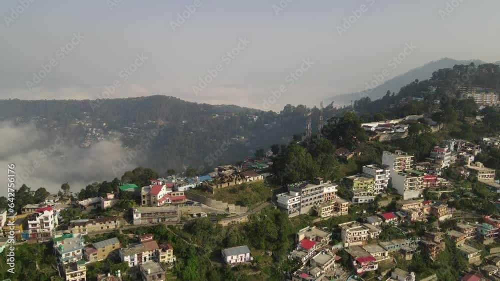Aerial shot of Almora city covered in clouds. Aerial shot of Almora city covered in clouds.