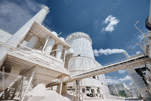 Industrial factory for limestone production under blue sky photo