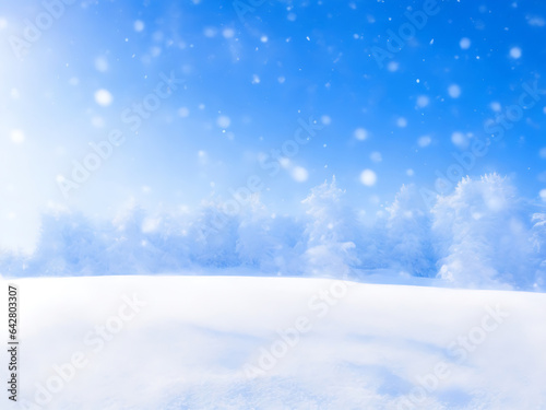 Winter snow background with snowdrifts, bokeh circles, and snowflakes on blue sky. Banner format with copy space © Touhid