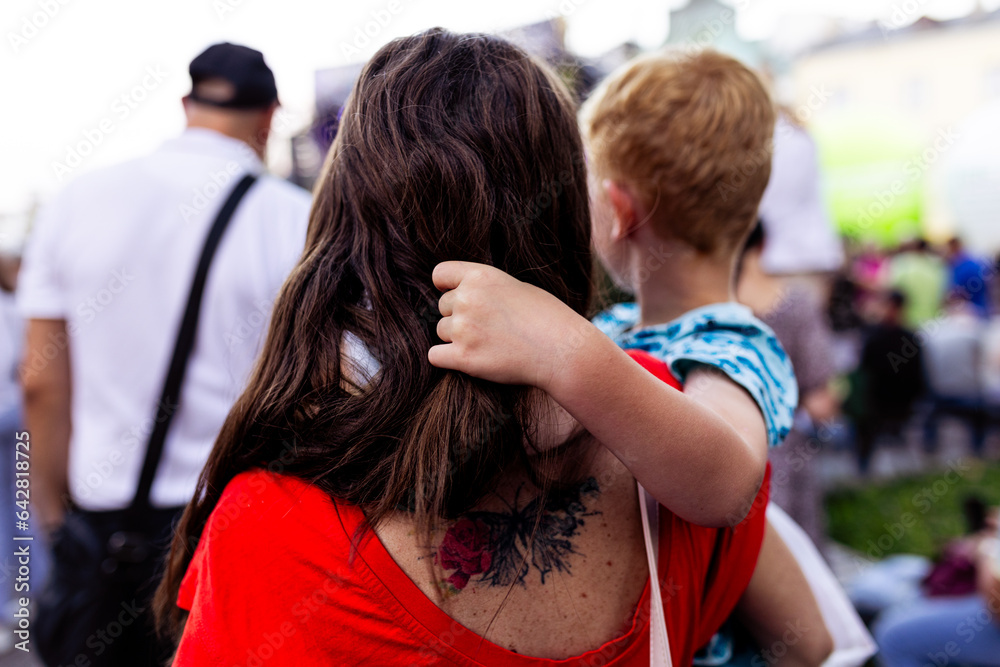 little boy on his mother's arms
