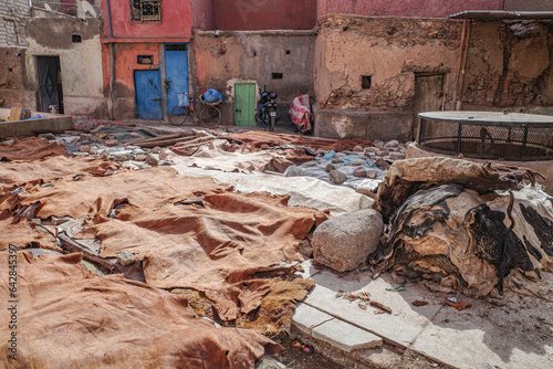 Marrakech, Morocco - Feb 10, 2023: Tanned leather pieces drying in the sun on a street in the Medina of Marrakech photo