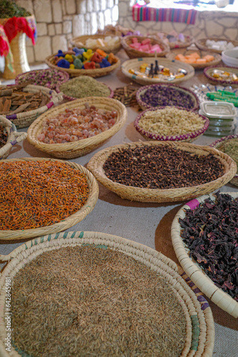 Marrakech, Morocco - Feb 22, 2023: Dried flowers and spices on a stall in Marrakech © Mark