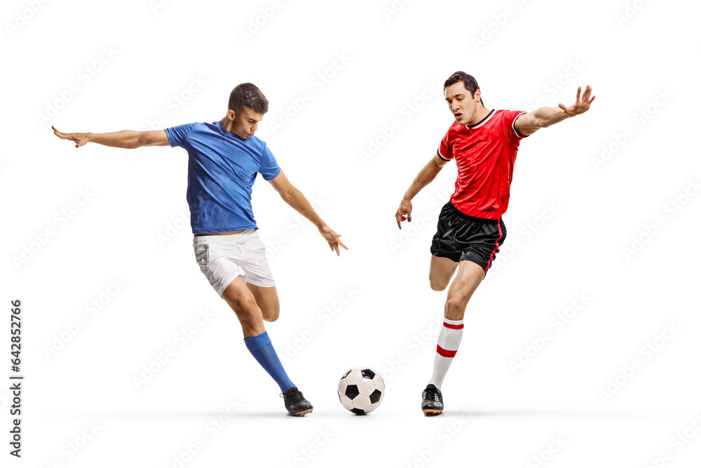 Football players from different teams running towards a ball