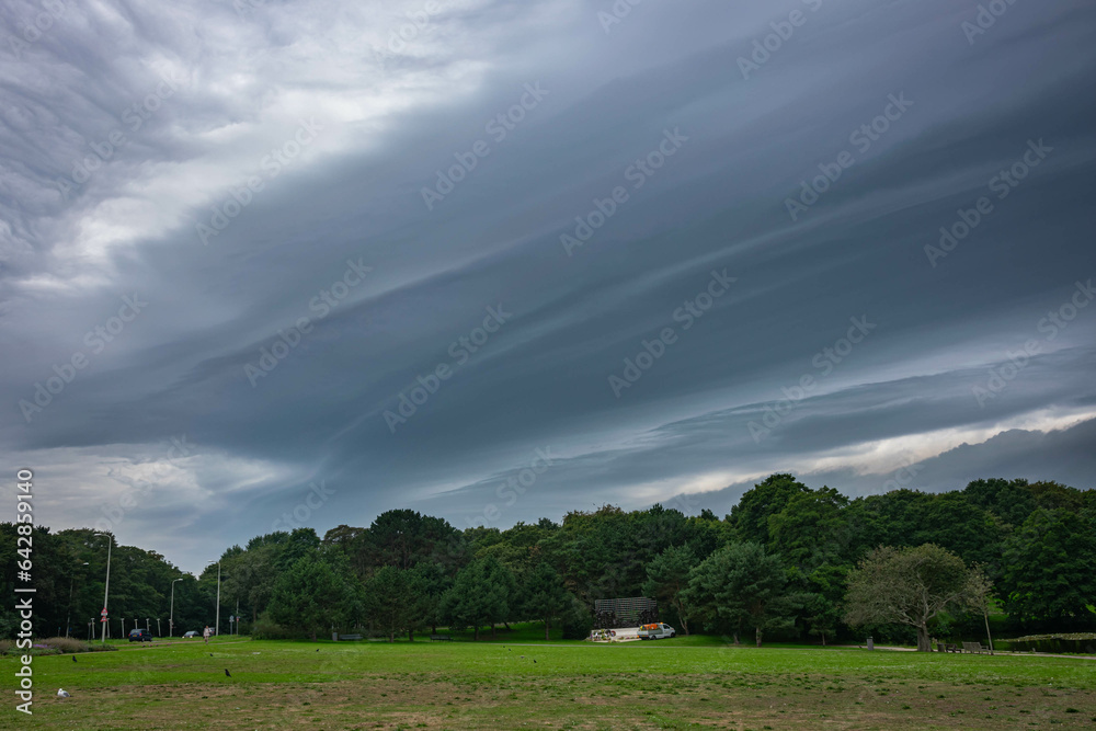 Emerging severe weather is preceded by a shelf cloud (arcus) with striations Emerging severe weather is preceded by a shelf cloud (arcus) with striations