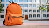 orange school backpack,  light orange school backpack placed on a front on the school building, Ai Generate 