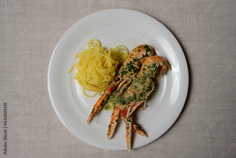 Scampi Buzara or Skampi na Buzaru King Prawns with Linguine, Garlic, Parsley and White Wine Sauce, a Typical Croatian Dish Scampi Buzara or Skampi na Buzaru King Prawns with Linguine, Garlic, Parsley and White Wine Sauce, a Typical Croatian Dish