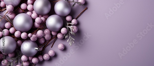 against a lavender background, Christmas tree branches with balls.