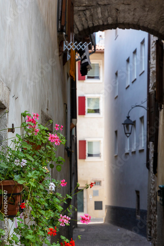 Residential houses in the Italian town of Arco on Lake Garda under blue sky and light clouds