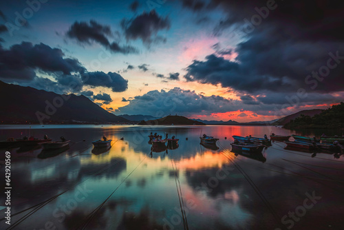 sunrise or sunset over lake with reflection