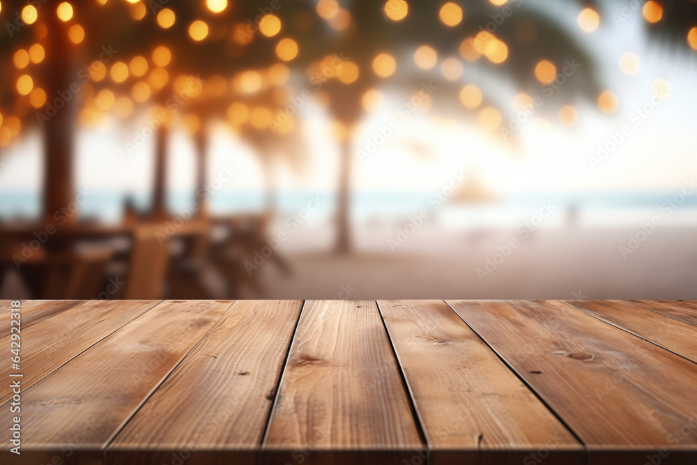 Wooden table and blur beach cafes background with bokeh lights. High quality photo - obrazy, fototapety, plakaty 