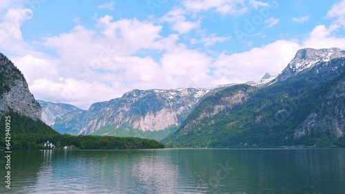 The clear lake of Hallstatt in the blue sky