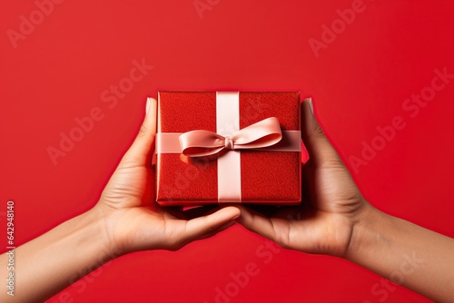 Hand holding red Gift box , christmas gift , happy new year, Generative Ai © Amir