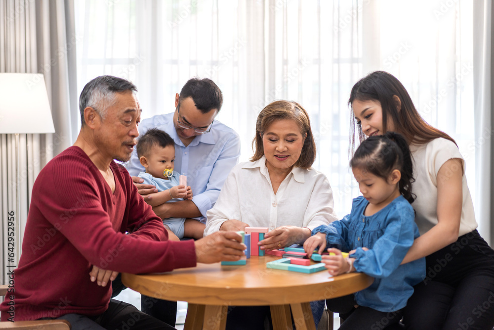 Portrait of happy love family asian father and mother playing with adorable asian baby and sister girl.newborn, infant.mom touching with cute son moments good time with grandparents.Love of big family
