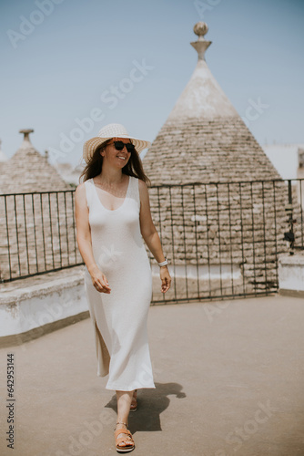 A young woman in a white dr...