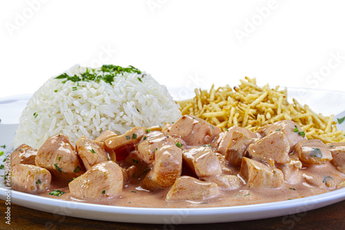 Chicken stroganoff with straw potatoes and rice photo