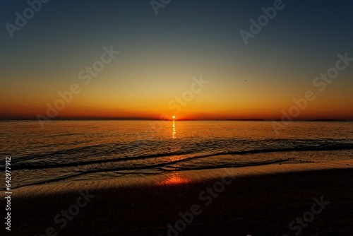 Sunrise sunset on the beach shore of Lake Erie