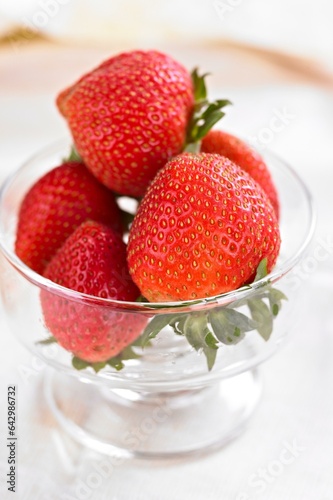 Strawberry Elegance: 4K Close-Up of Fresh Strawberries Dipped in a Glass Cup