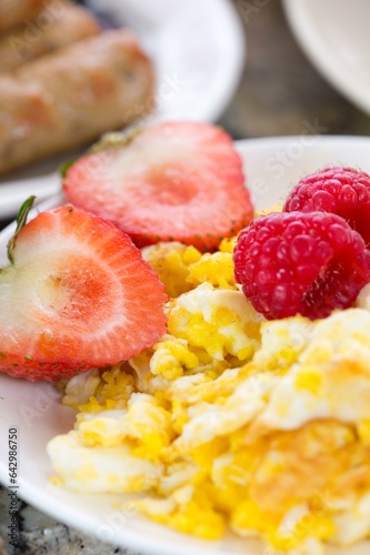 Morning Delight: 4K Close-Up of Scrambled Eggs with Fresh Strawberries