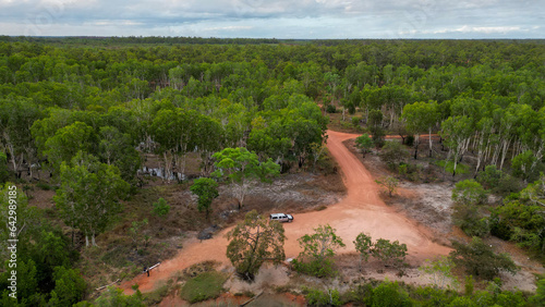 Aerial view of remote Queensland bush wih trees and orange sand, photo
